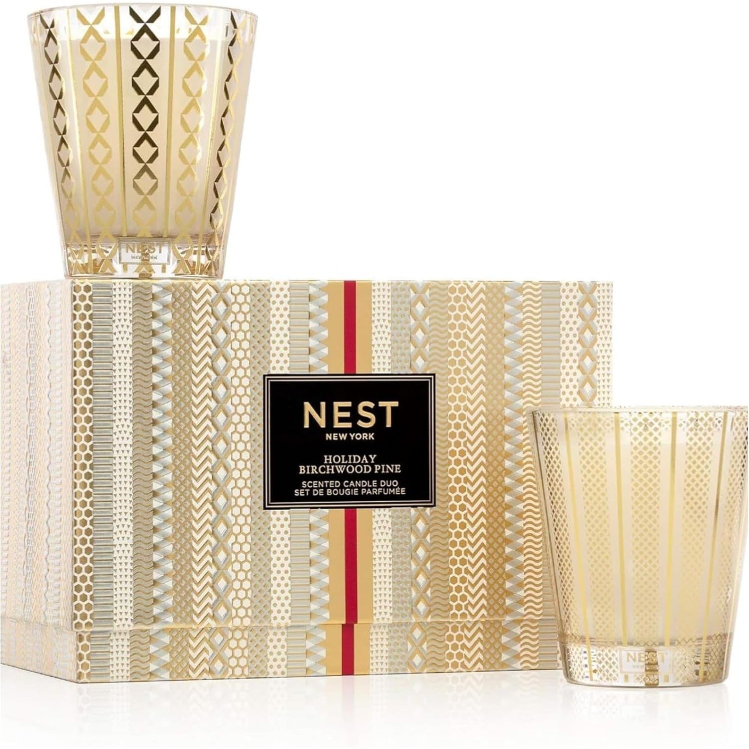 NEST New York Holiday and Birchwood Pine Classic Candle set displayed in elegant glass vessels.