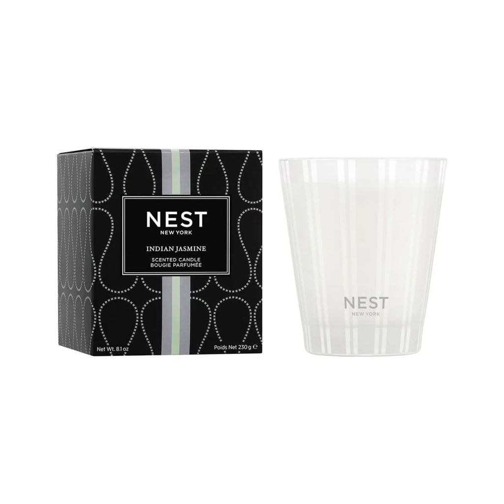 NEST New York Indian Jasmine scented candle in a white and sage green glass vessel with floral patterns.