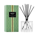 Nest New York Santorini Olive and Citron Reed Diffuser 5.9 OZ in a glass vessel with fragrance reeds.