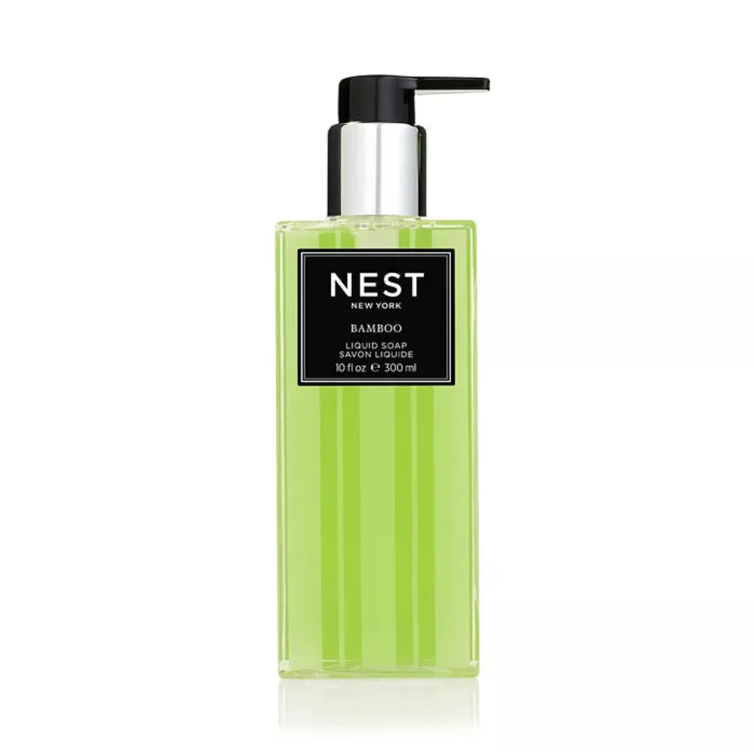 NEST New York Bamboo liquid soap in a lime green and black striped glass bottle with a chrome pump.