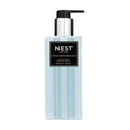 Modern 10 oz bottle of Ocean Mist and Sea Salt liquid soap with minimalist black and white label on a blue liquid base.