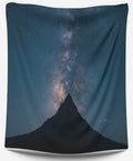A modern Nightspire tapestry featuring a mountain peak against a navy blue and black celestial Milky Way sky.