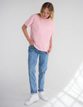 No Greater Love unisex graphic tee in Nectar pink cotton with white text