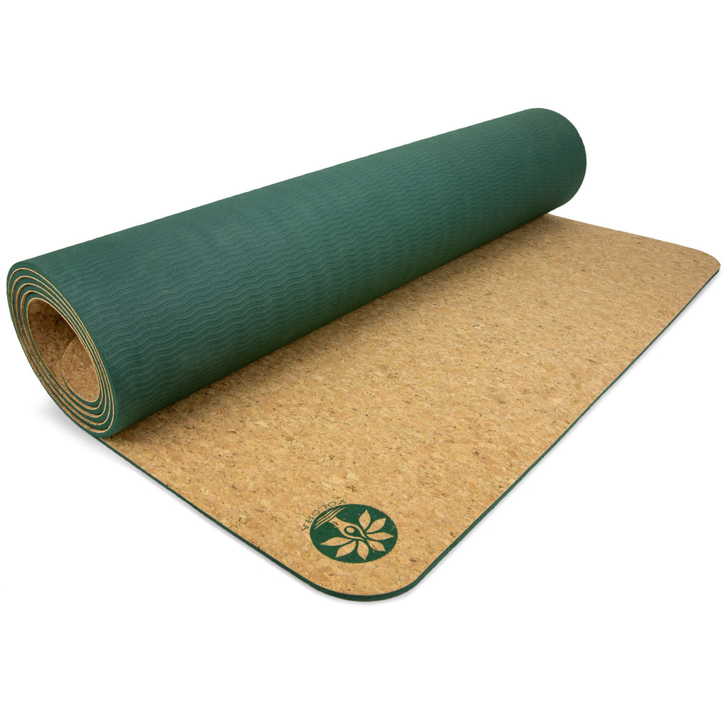 Solid color Nomad cork yoga mat in green and tan