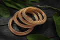 Luxury golden bangle set adorned with sparkling white stones