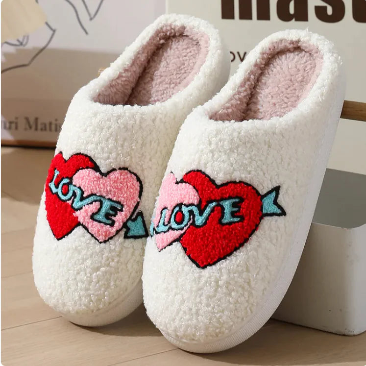 Plush white house slippers with red and pink heart embroidery