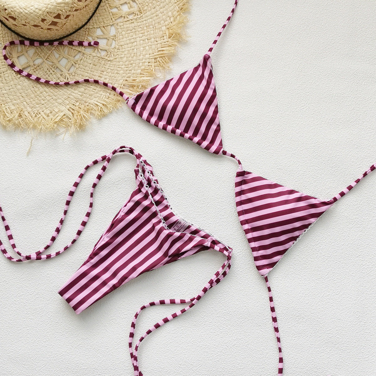 Burgundy and light-pink striped backless halter bikini with tie-up low-waist bottoms.