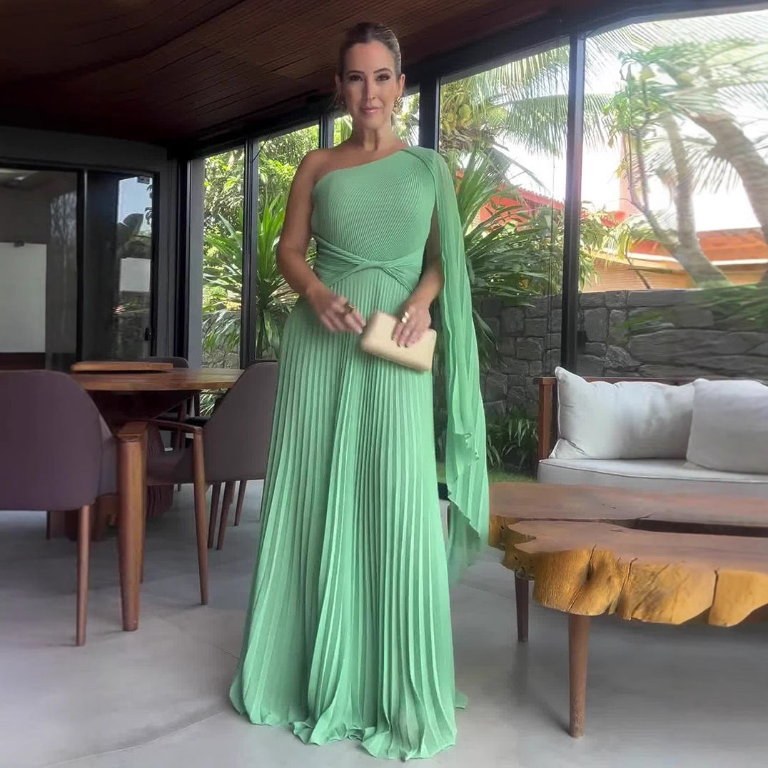 Sleeveless long dress with a diagonal collar, cinched waist, and a flounced skirt, available in vibrant colors.