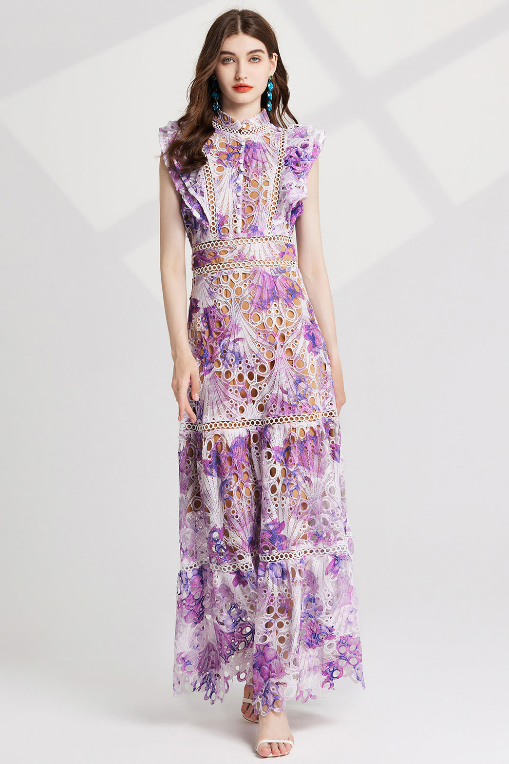 Model wearing a sophisticated women's maxi dress in a floor-length silhouette