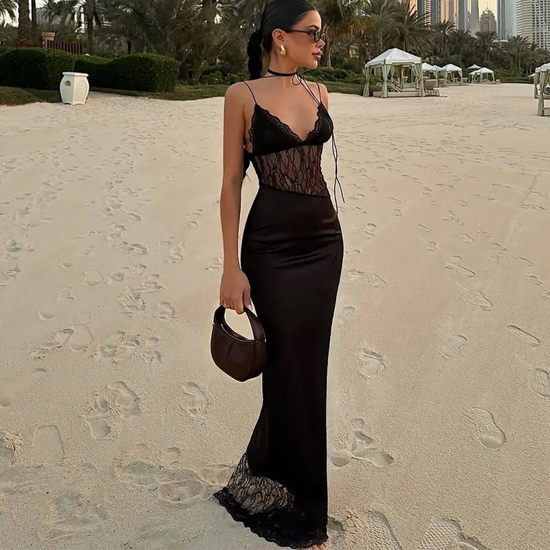 Close-up of a slim-fit black mesh and lace mini dress with low-collar tie detail