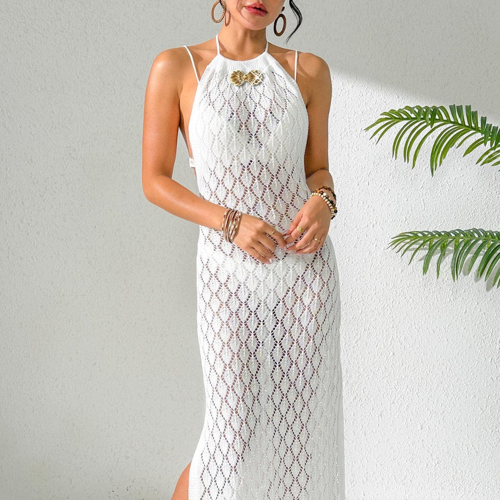 A slim-fit maxi beach dress with metal shell button decorations, backless tie design, and a side split.