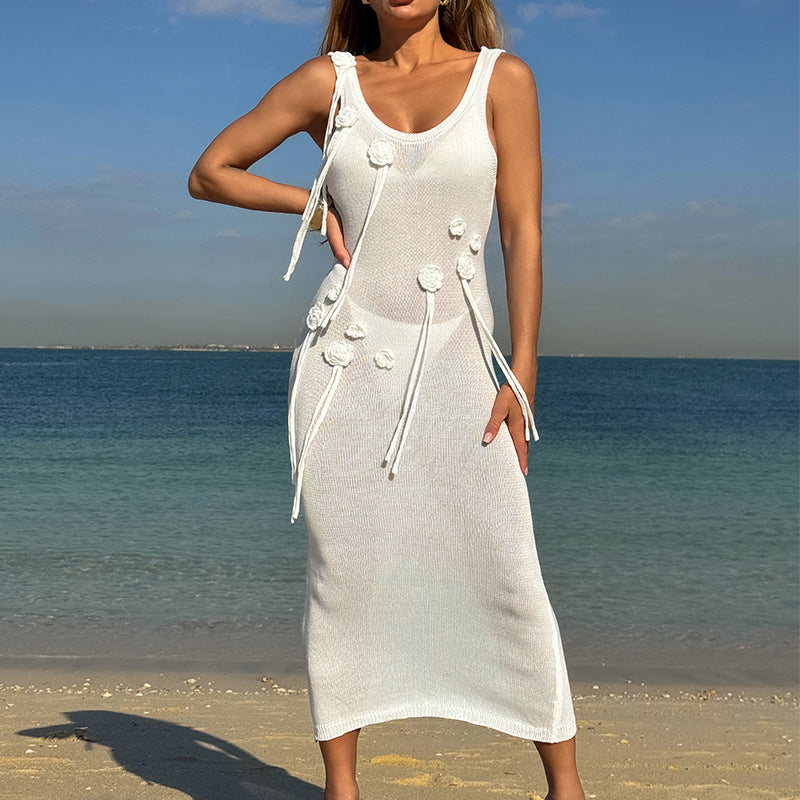 Model wearing a fitted lime-yellow knit midi dress with 3D floral details and scoop neckline at the beach