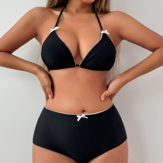 A romantic lace halter bikini swimsuit with tie closure available in black and white