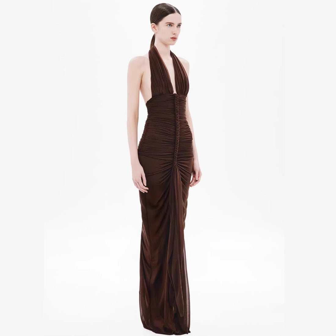 Model wearing a sexy slim-fit V-neck halter dress with ruched hip detail and backless design