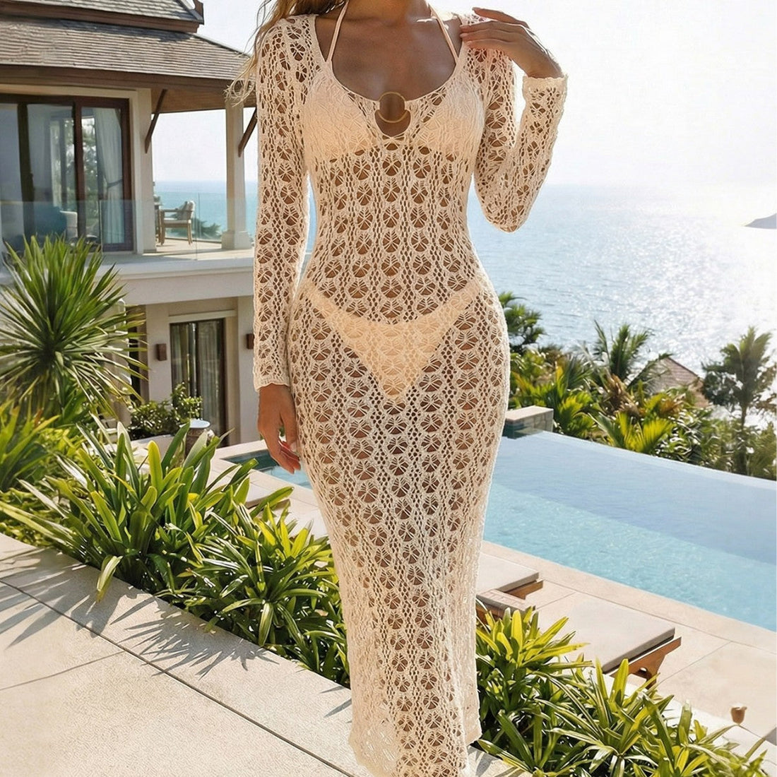 Beige knitted hollow-out backless blouse with metal ring detail, perfect for beach resort wear.