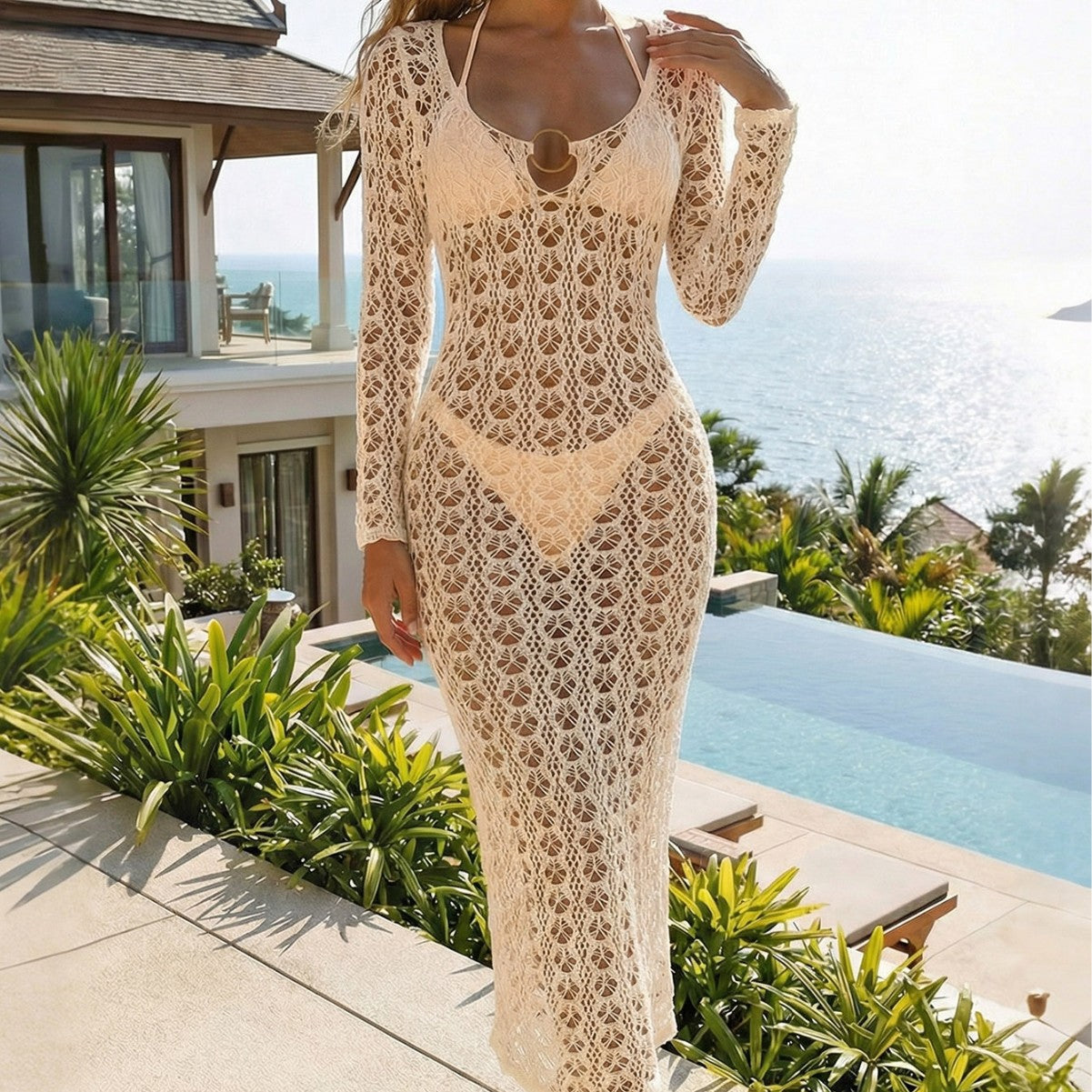 Beige knitted hollow-out backless blouse with metal ring detail, perfect for beach resort wear.