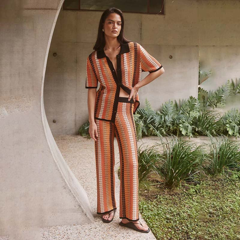 Woman wearing a loose-fit knitted two-piece set with a vintage stripe pattern and button details.