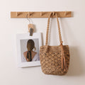 Woven Straw Shoulder Bag with Decorative Tassel and Cutout Design - Image 2