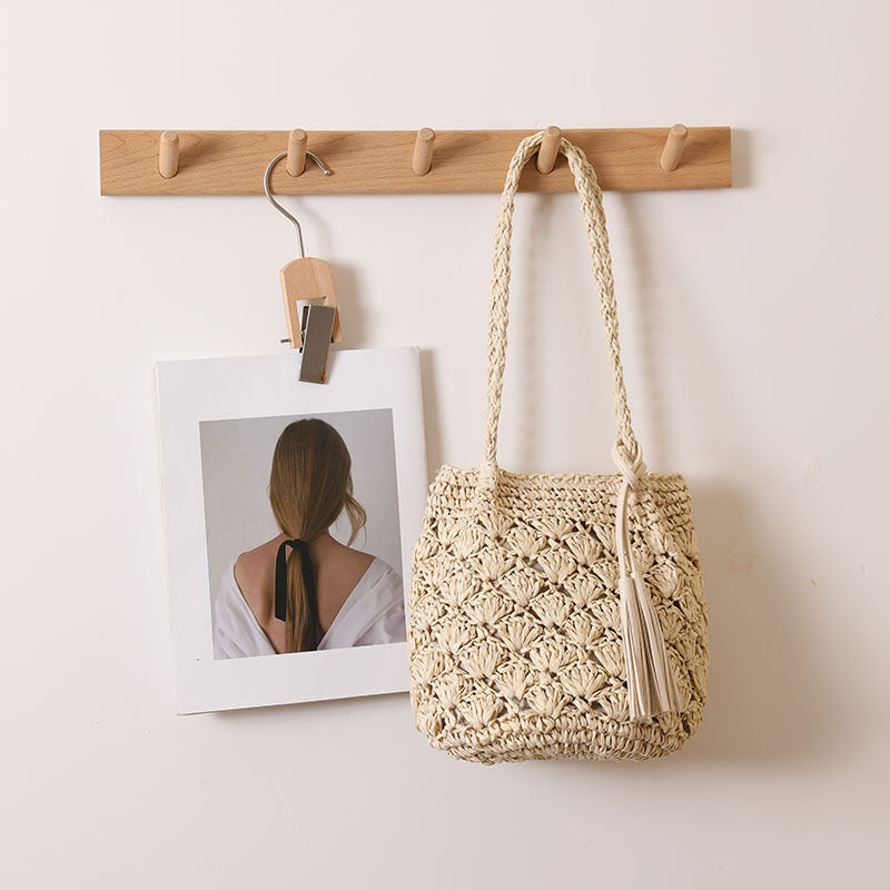 Woven Straw Shoulder Bag with Decorative Tassel and Cutout Design - Image 3