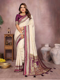 A cream-colored Kalamkari silk saree featuring detailed artisanal weaving and traditional prints.