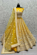 Yellow net wedding lehenga choli with sequin and thread embroidery detailing