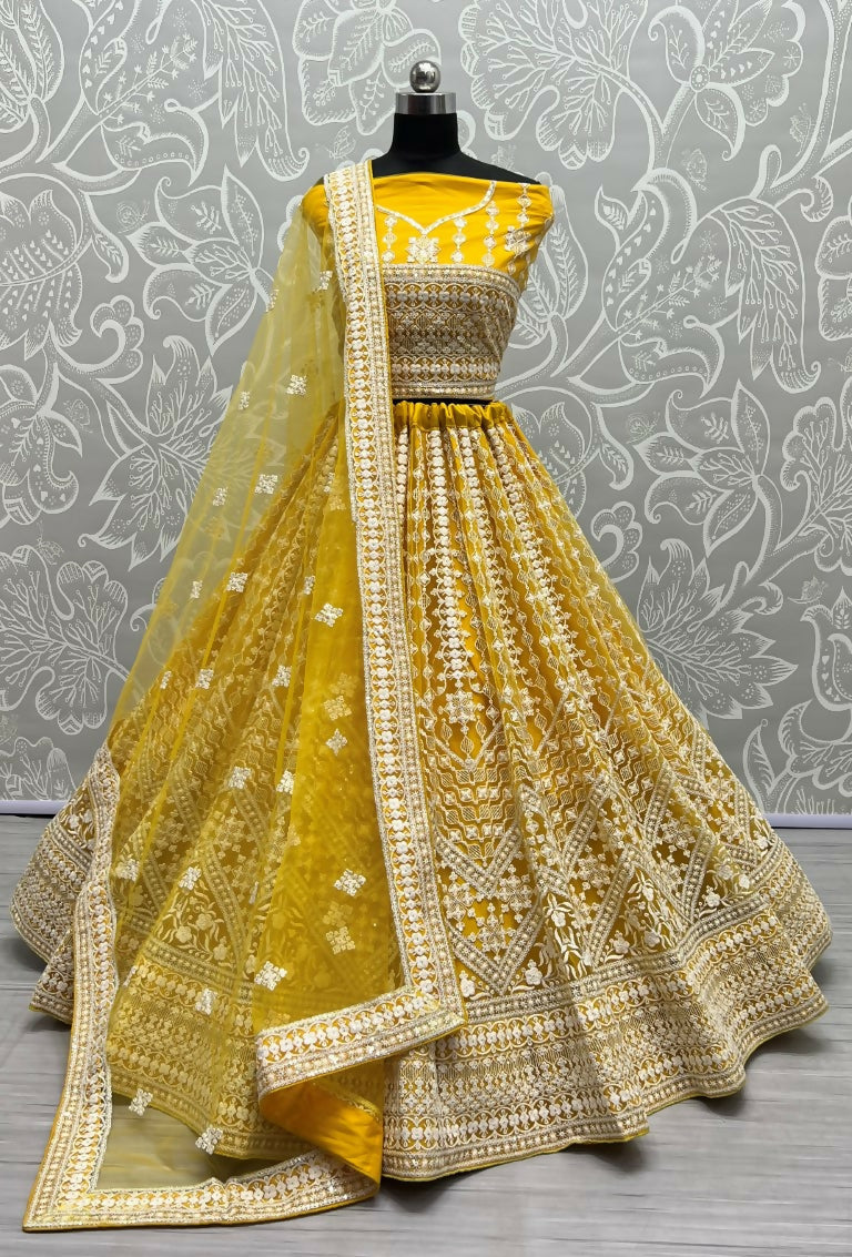 Yellow net wedding lehenga choli with sequin and thread embroidery detailing