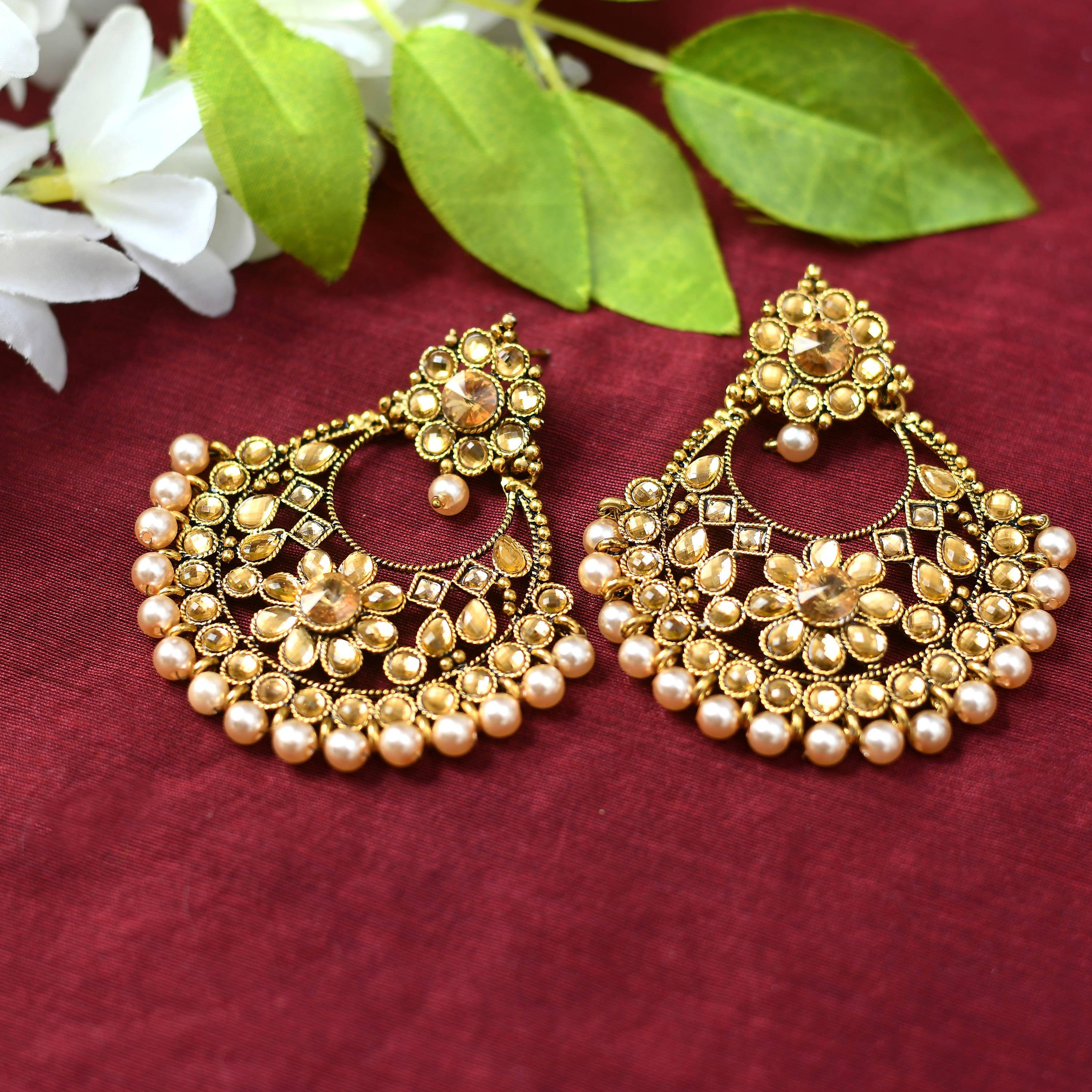 Sophisticated golden and white beaded earrings designed for women.