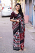Grey linen blend saree with ethnic motifs and matching unstitched blouse