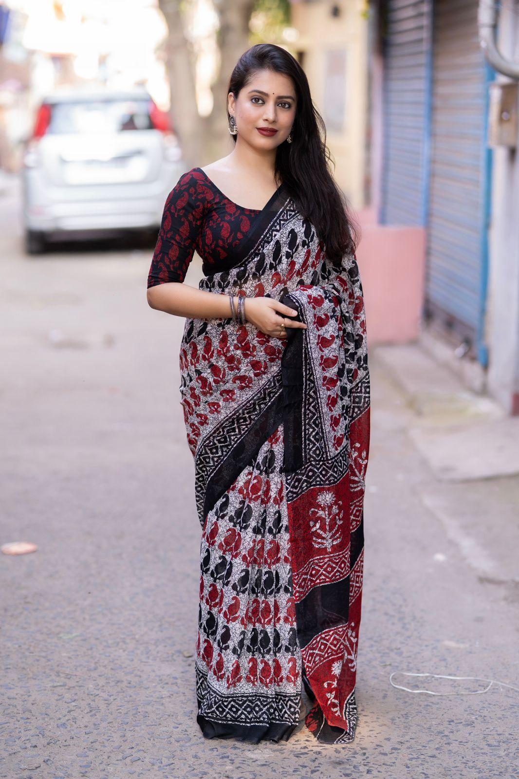 Grey linen blend saree with ethnic motifs and matching unstitched blouse