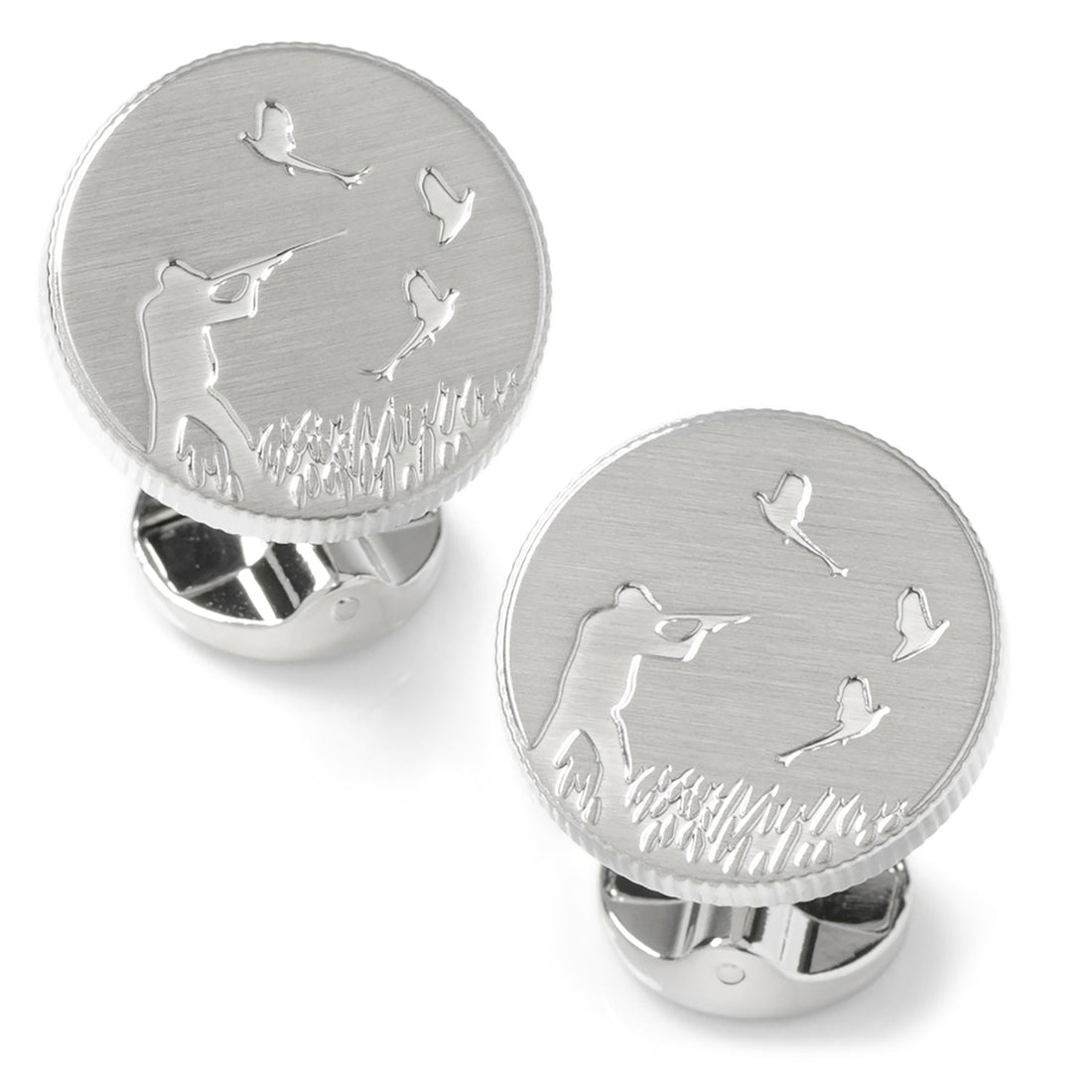 Close up of round silver hunter cufflinks with embossed hunting scene and brushed matte finish