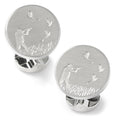Close up of round silver hunter cufflinks with embossed hunting scene and brushed matte finish