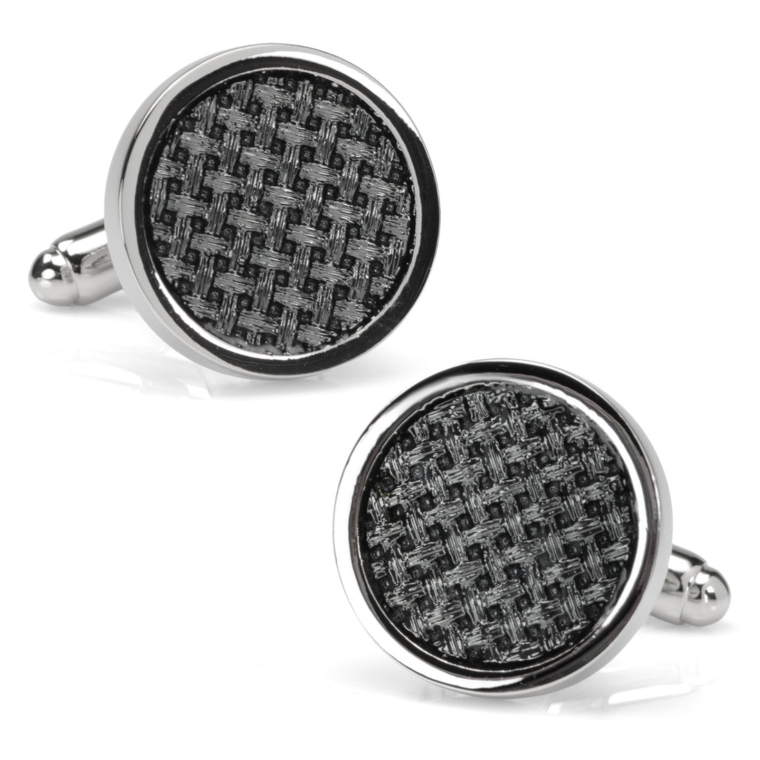 A pair of round black woven metal cufflinks with polished silver edges worn on a dress shirt cuff