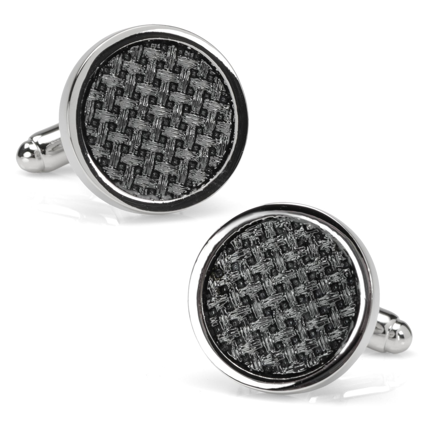 A pair of round black woven metal cufflinks with polished silver edges worn on a dress shirt cuff