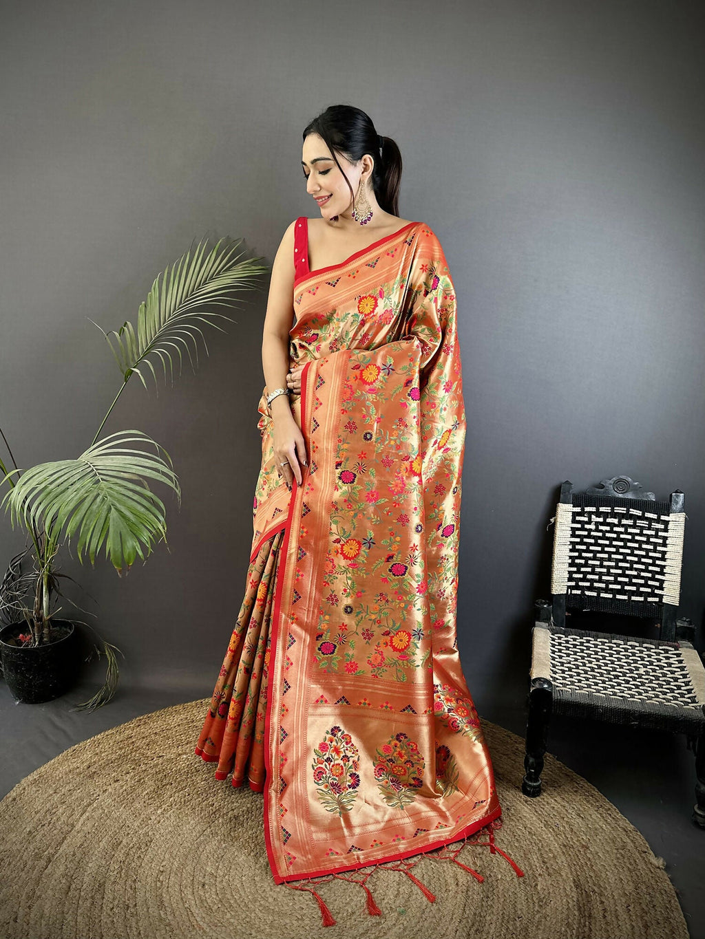 Peach soft silk Paithani saree with floral and leaf motif details
