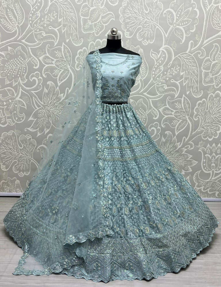 Aqua heavy net wedding lehenga with dori, multi-thread, and rainbow sequins