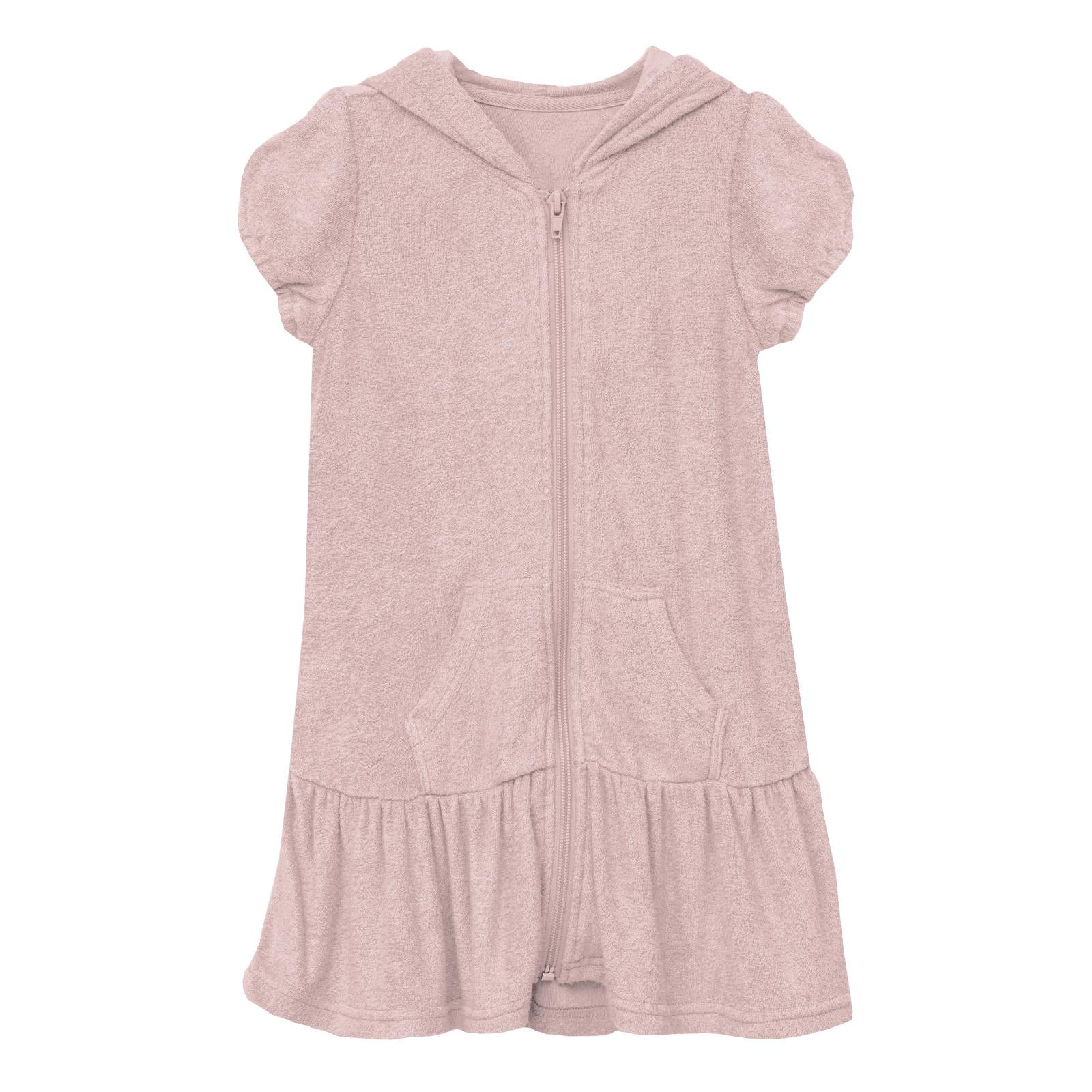Baby wearing a soft pink terry cloth swim cover-up with ruffle hem and hood in Baby Rose color