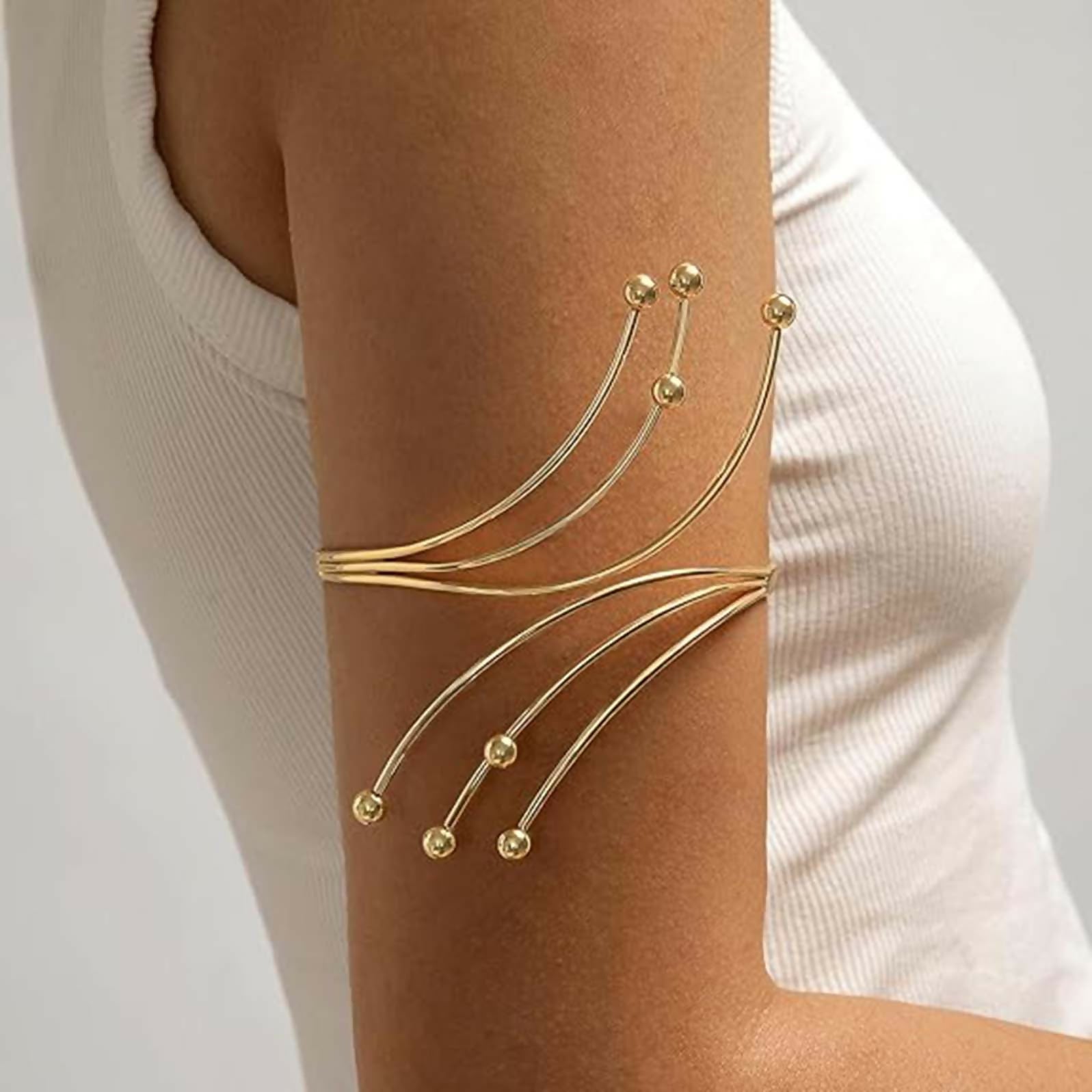 Close up of a stylish golden alloy gold-plated kada bajuband for traditional ethnic wear