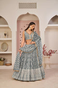 Gray butterfly net lehenga choli featuring white cotton thread, zari, and sandwich sequence embroidery for wedding wear