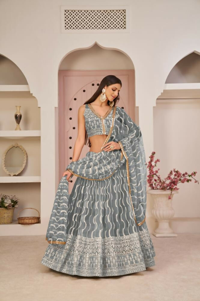Gray butterfly net lehenga choli featuring white cotton thread, zari, and sandwich sequence embroidery for wedding wear