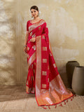 Model wearing a vibrant red silk blend saree with a matching blouse.