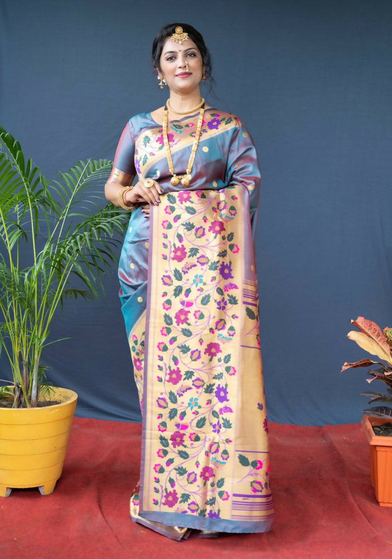 Chic grey Paithani silk saree with intricate Zari woven detailing and matching grey blouse.