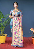 Chic grey Paithani silk saree with intricate Zari woven detailing and matching grey blouse.