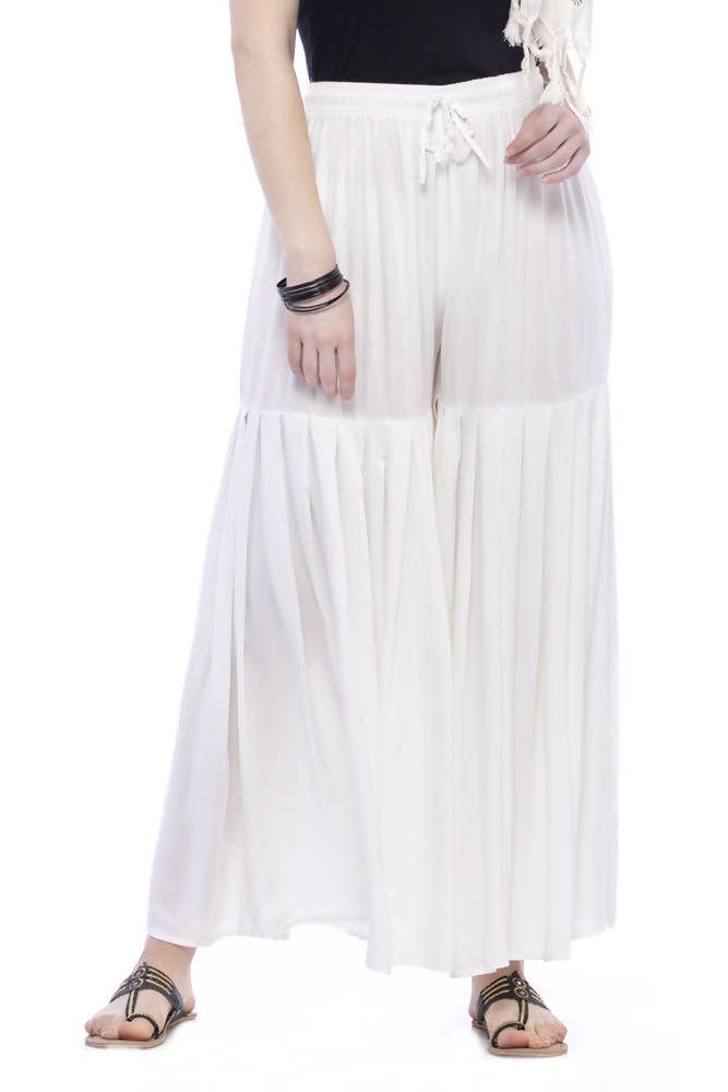 A pair of crisp off-white rayon cotton solid palazzo pants with a comfortable relaxed fit.