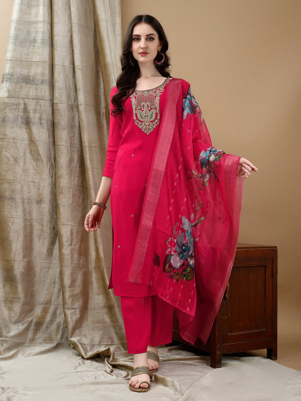A pink Chanderi kurta set with intricate hand embroidery and lace details, including matching pants and dupatta.