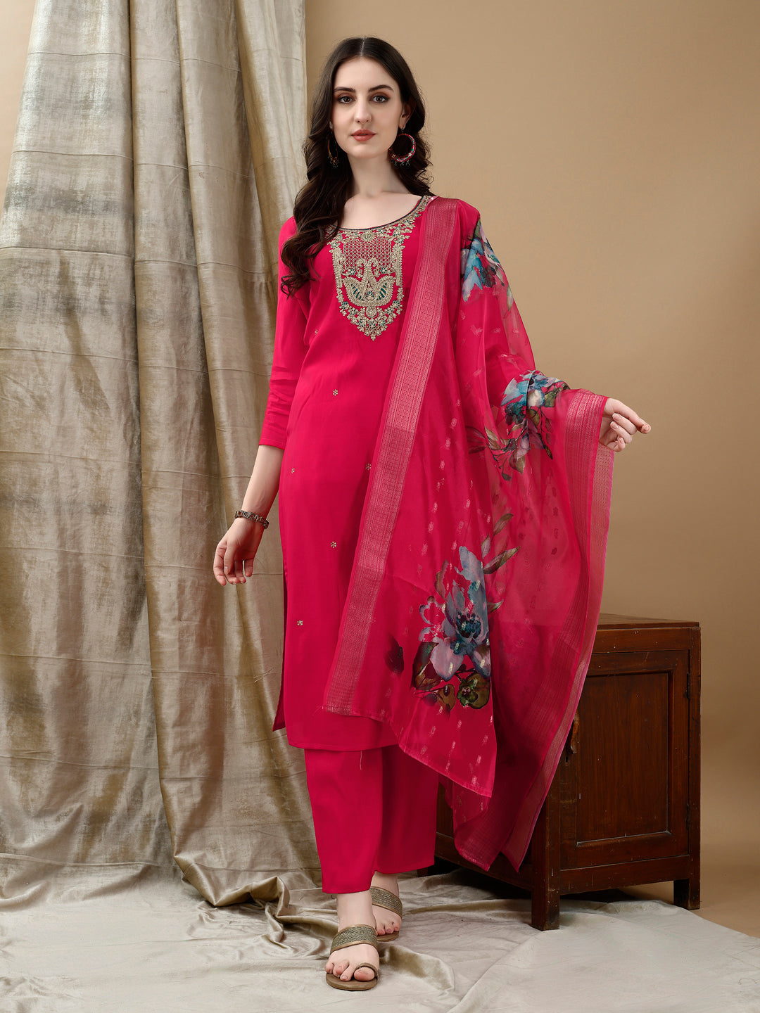 A pink Chanderi kurta set with intricate hand embroidery and lace details, including matching pants and dupatta.
