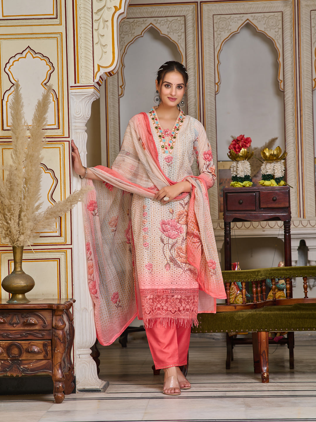 Woman wearing a multicolor schiffli embroidered kurta with matching pants and printed dupatta