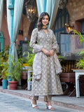 A woman wearing a grey embroidered and printed flared kurta set with matching pants and dupatta.