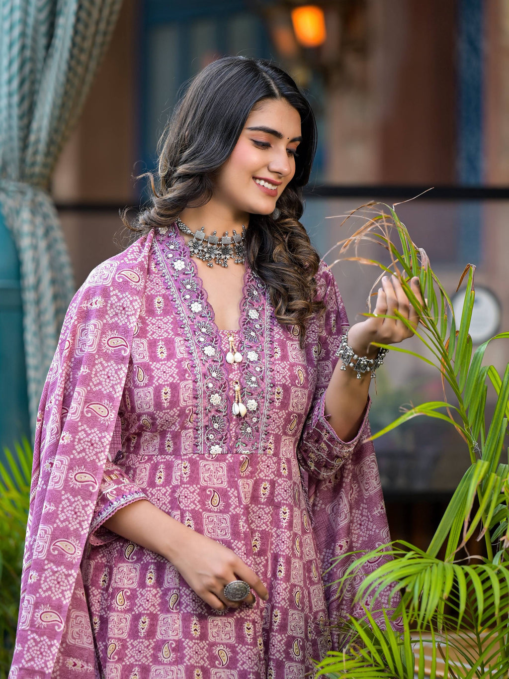 Pink embroidered flared kurta set with cotton fabric featuring 3/4 sleeves