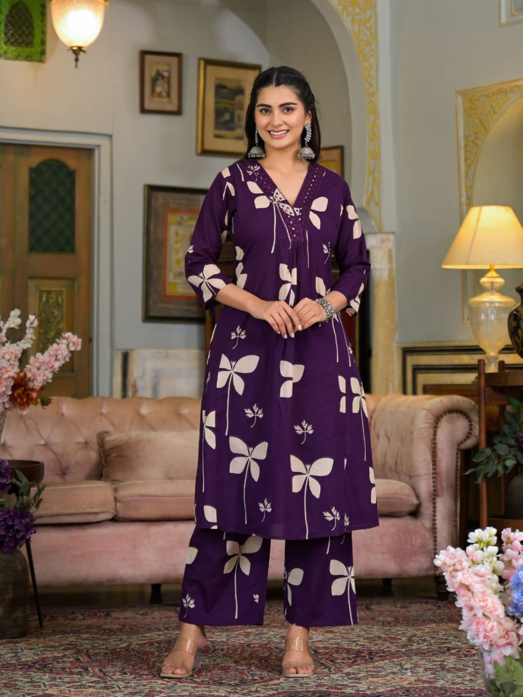 Violet cotton kurta with intricate neckline embroidery and floral print, styled with matching palazzo pants.