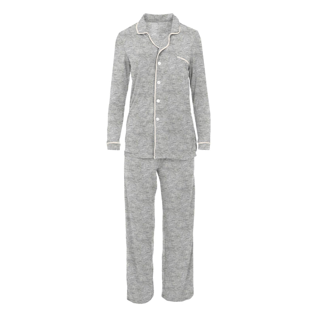 A woman wearing a soft heathered mist grey long-sleeved collared button-up pajama set with relaxed fit pants.